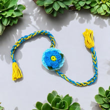 Load image into Gallery viewer, Premium Plantable Flower Crochet Rakhi with Sunflower Seeds | Colour Blue | Combo with a DIY Grow Kit
